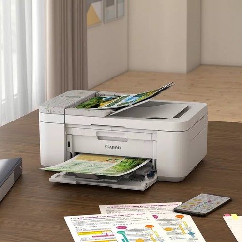 Imprimante Canon PIXMA TR4756i blanche installée sur un bureau de télétravail