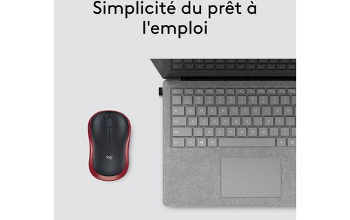 Souris Logitech M185 rouge posée près d'un ordinateur portable
